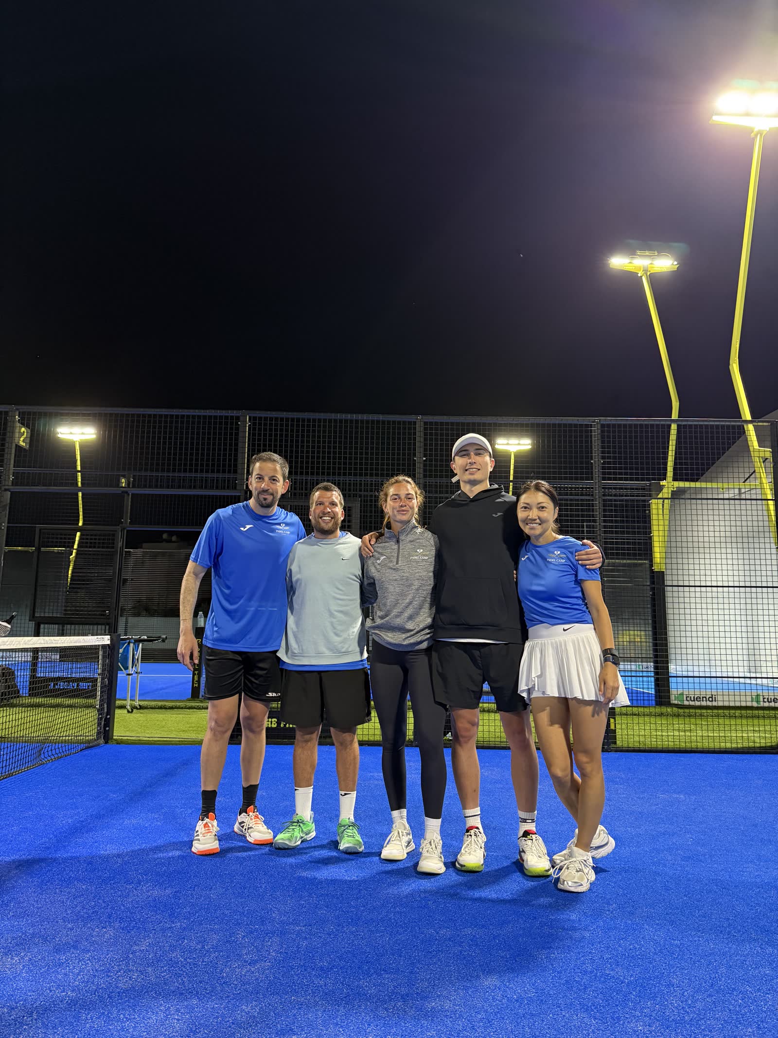 Padel Camp Cyprus coaches and staff posing together after an evening session