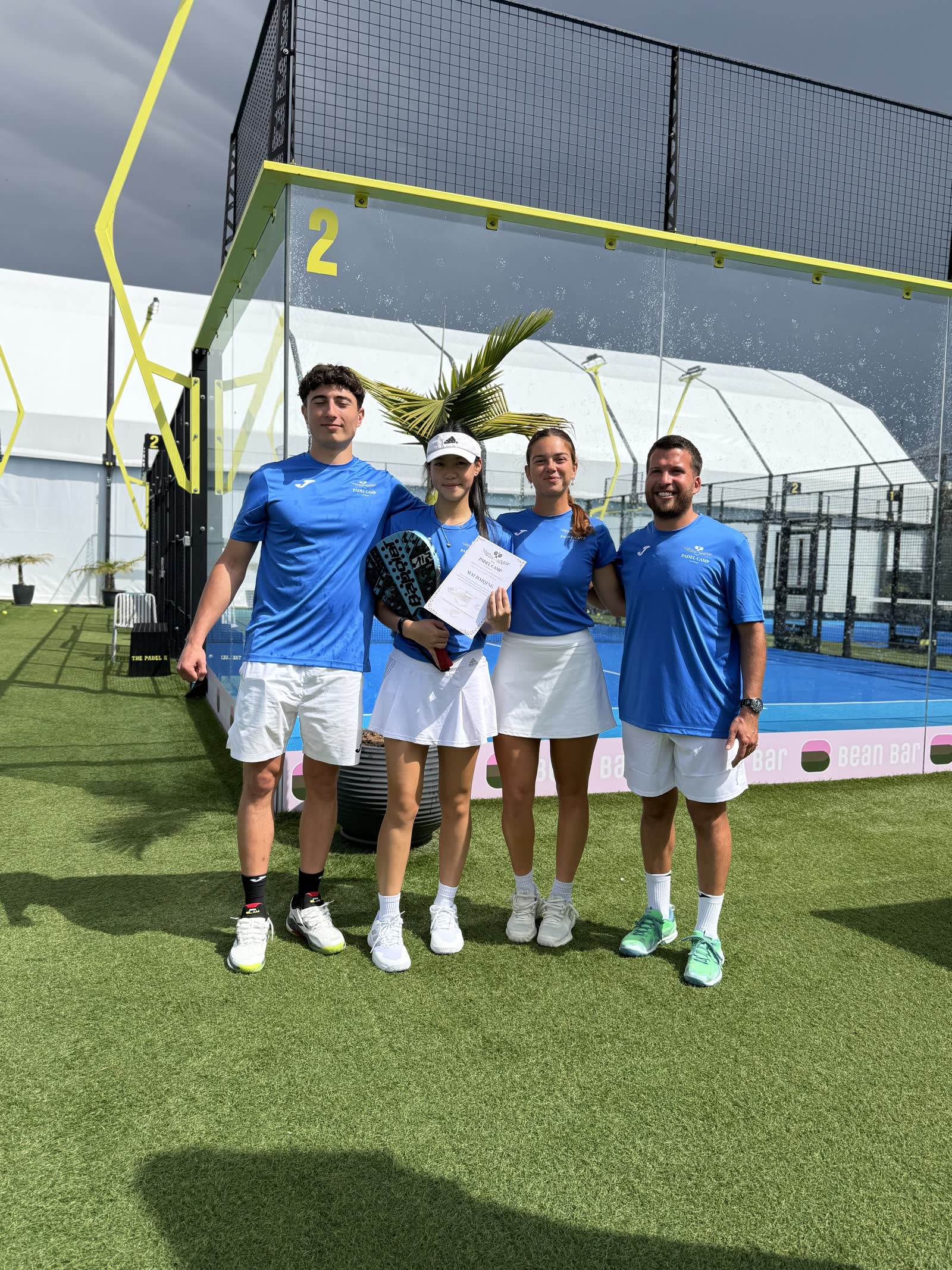 Padel Camp Cyprus participants holding a certificate of completion at The Padel K